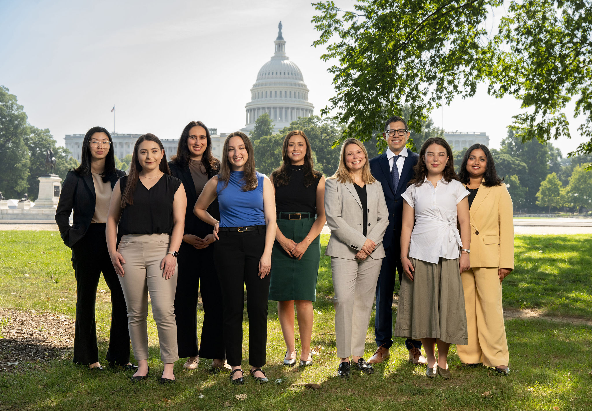 Group portrait of Strathdee Group team with U.S. Capitol dome in background